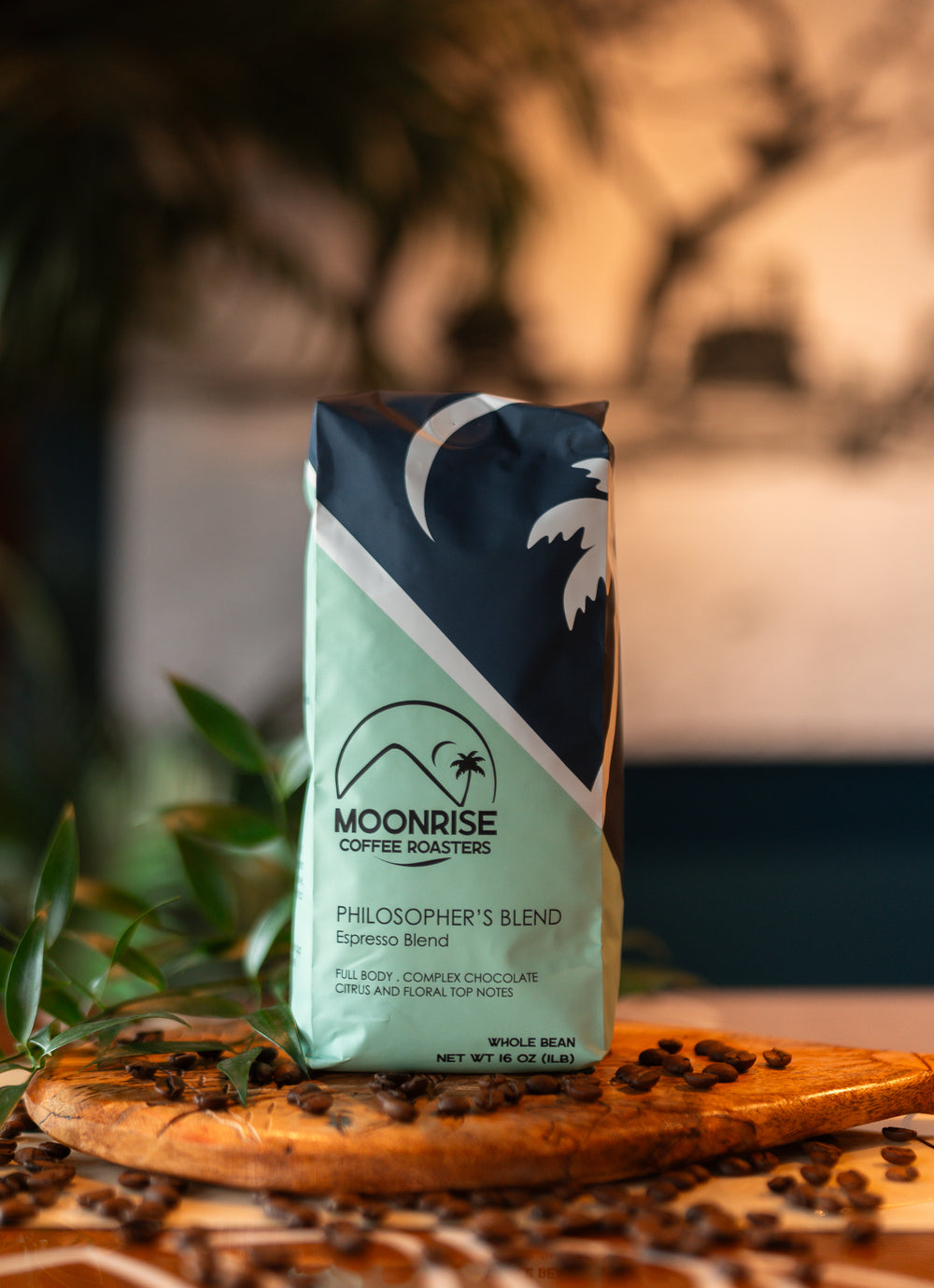 Moonrise Coffee Roasters Philosopher's Blend package on a wooden surface with coffee beans.